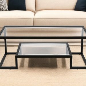 45" Clear And Black Glass And Steel Sled Coffee Table With Shelf