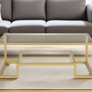 45" Clear And Gold Glass And Steel Sled Coffee Table With Shelf
